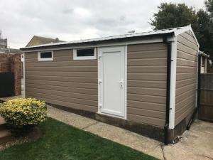 Garage Refurbishment with Argyl Brown Cladding | Danmarque Garages